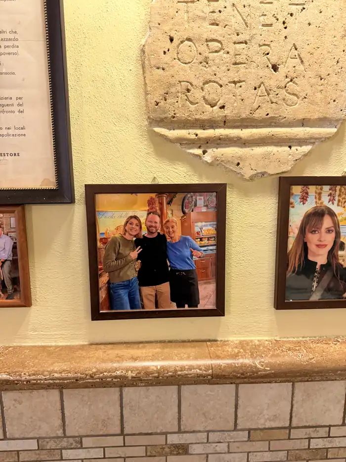 A framed photo of three people hanging on the restaurant wall