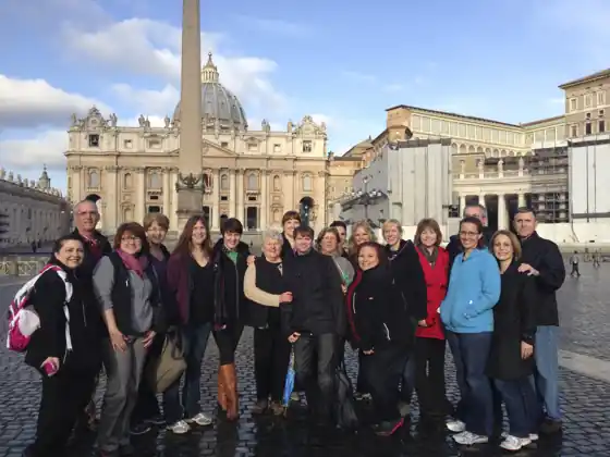 A pilgrimage group in Saint Peter’s Square, Rome, several wearing SCOTTeVEST