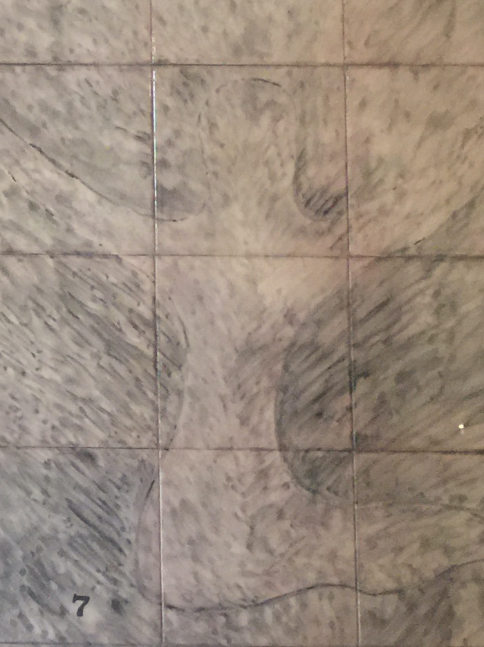 Drawing tracing the faint figure praying with outstretched arms on the dungeon wall